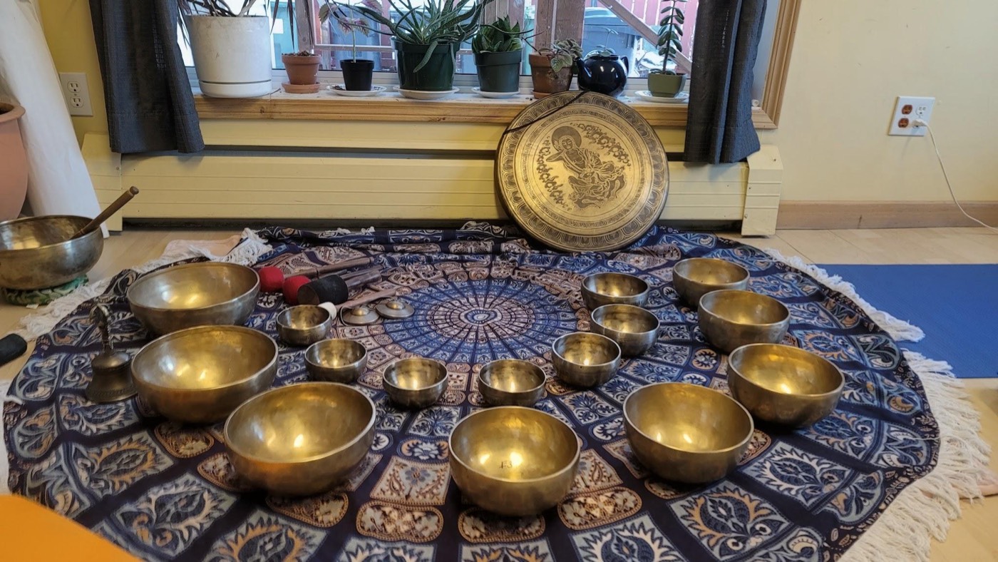 Singing bowls set out for a sound healing session at SOMA